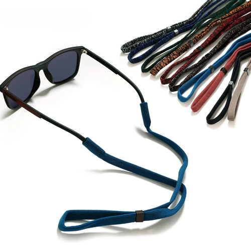 Blue sunglasses strap fitted to a pair of sunglasses, with other colors shown behind